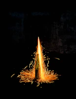 Dynamic splash of neon amber liquid bursting from a Divorox Ultra can.