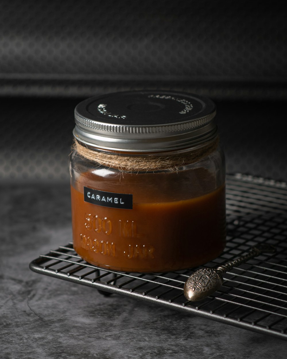 black and brown glass jar on black metal table