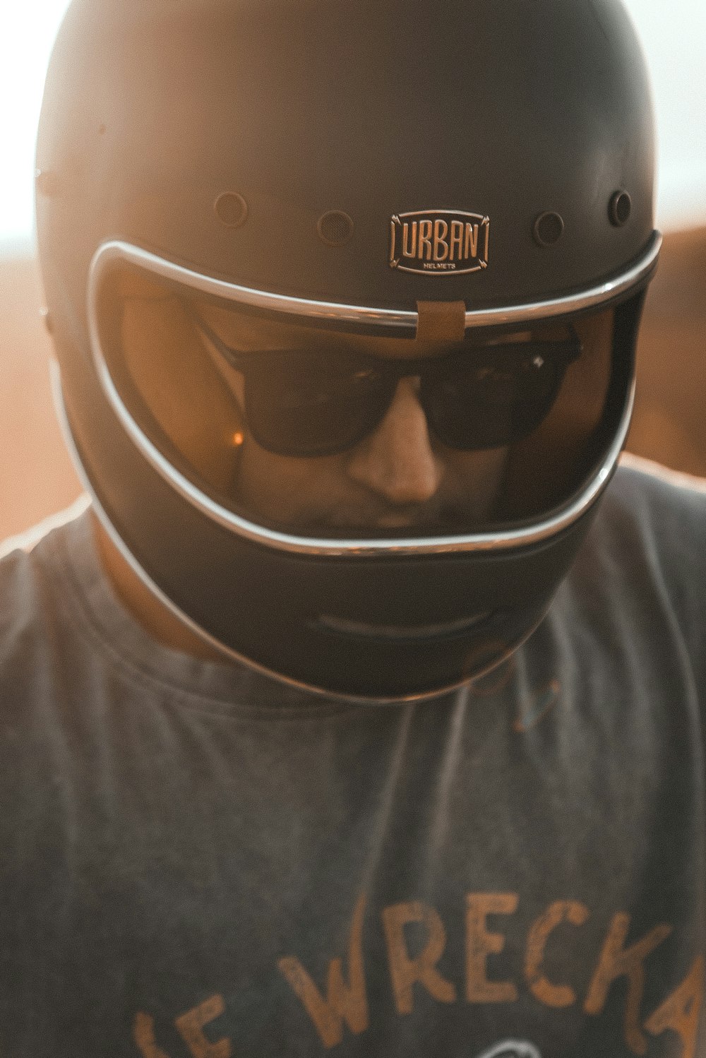 man in white crew neck shirt wearing black helmet