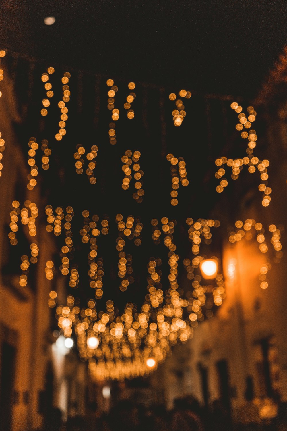 yellow string lights on brown wooden wall