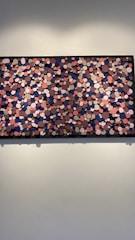 Island floating frame featuring an 8-ply mat surrounding a vibrant painting