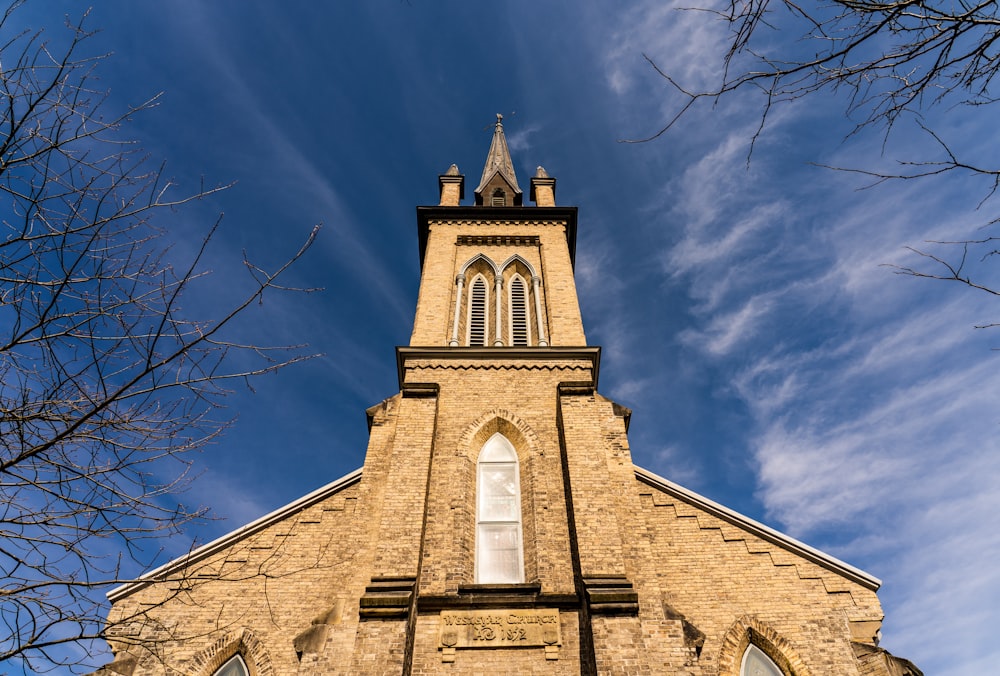 brown concrete building under blue sky during daytime