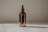 clear glass bottle with brown liquid