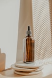 clear glass bottle on white table