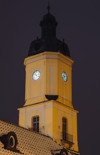 brown concrete building with clock