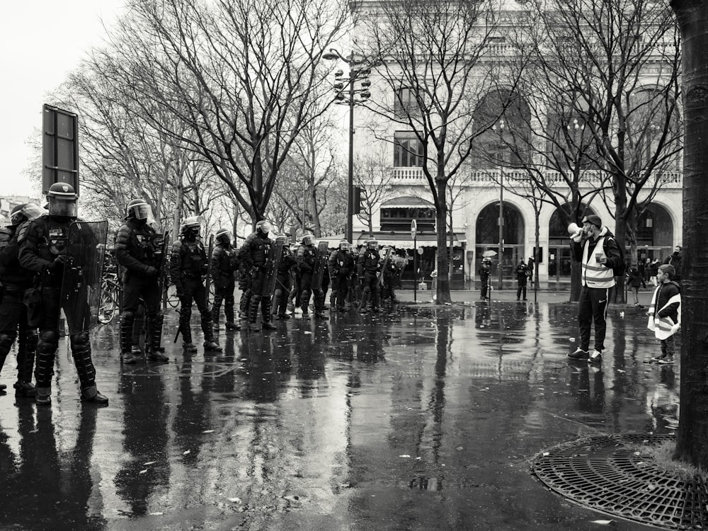 grayscale photo of people walking on street