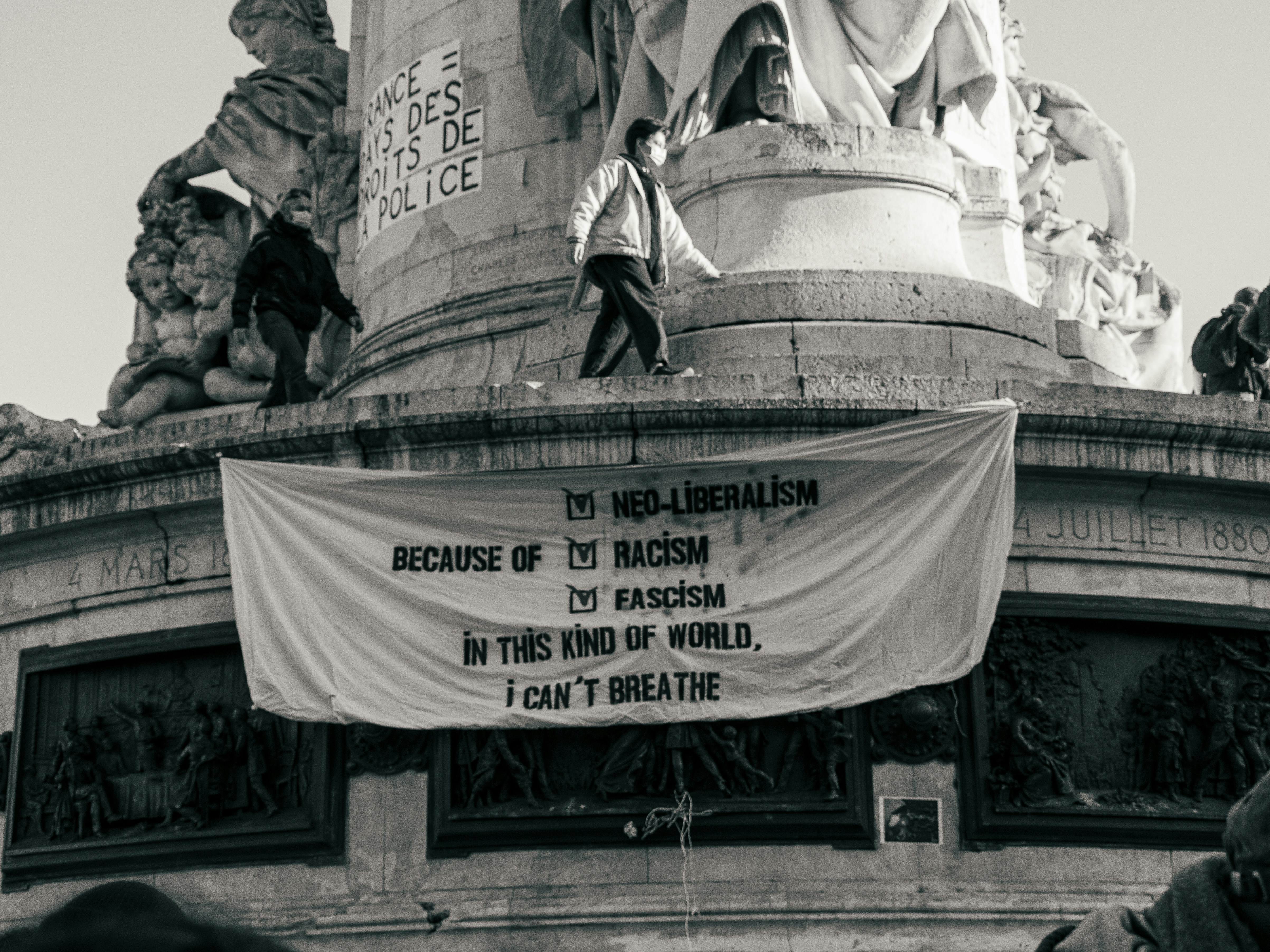 people sitting on the stairs of the building