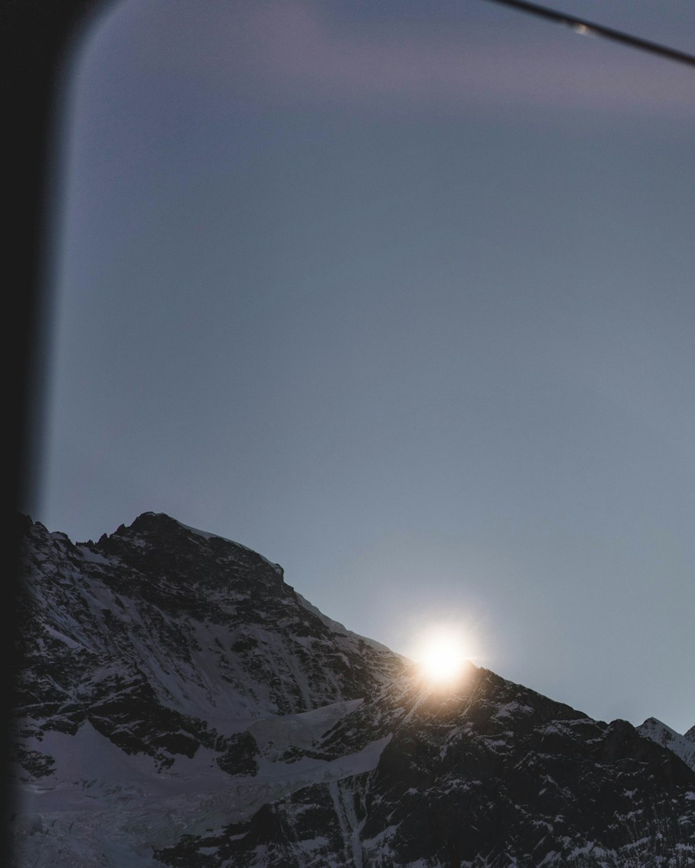 snow covered mountain during daytime