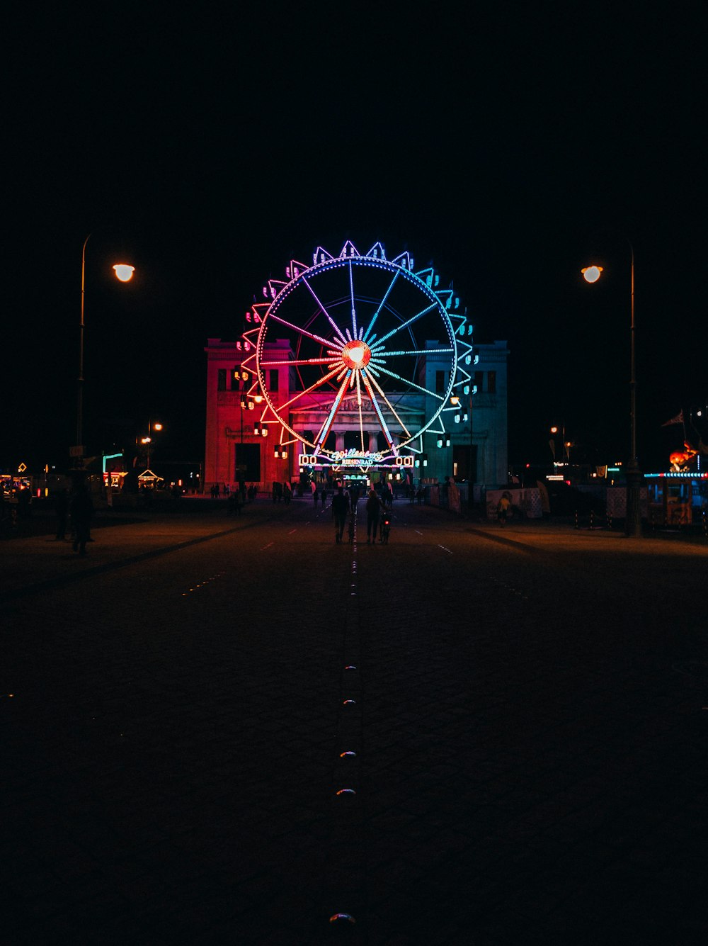 people walking on park during night time