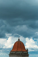 Before and after shot of a storm-damaged roof restored to pristine condition by Fortidome.