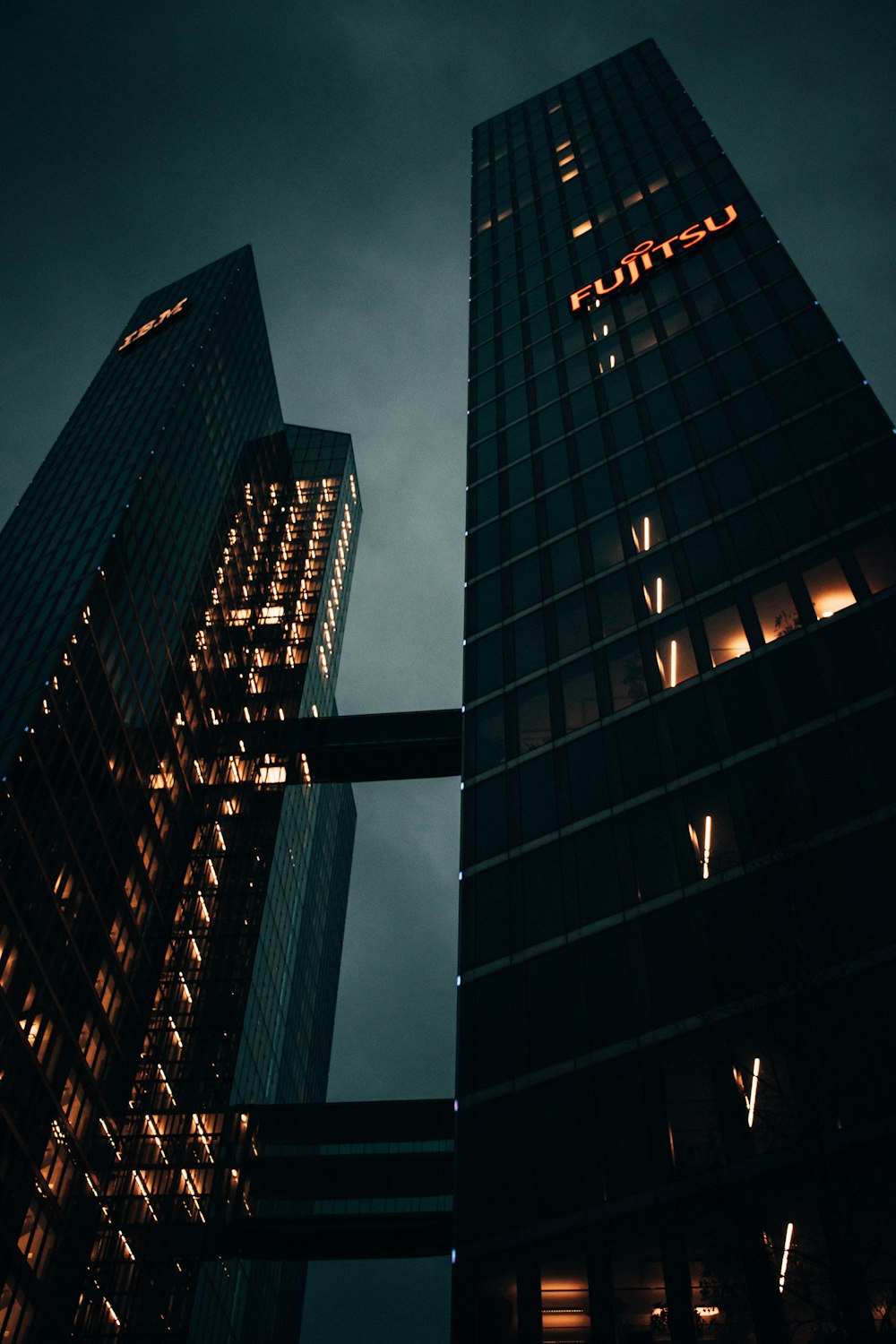 low angle photography of high rise building during nighttime