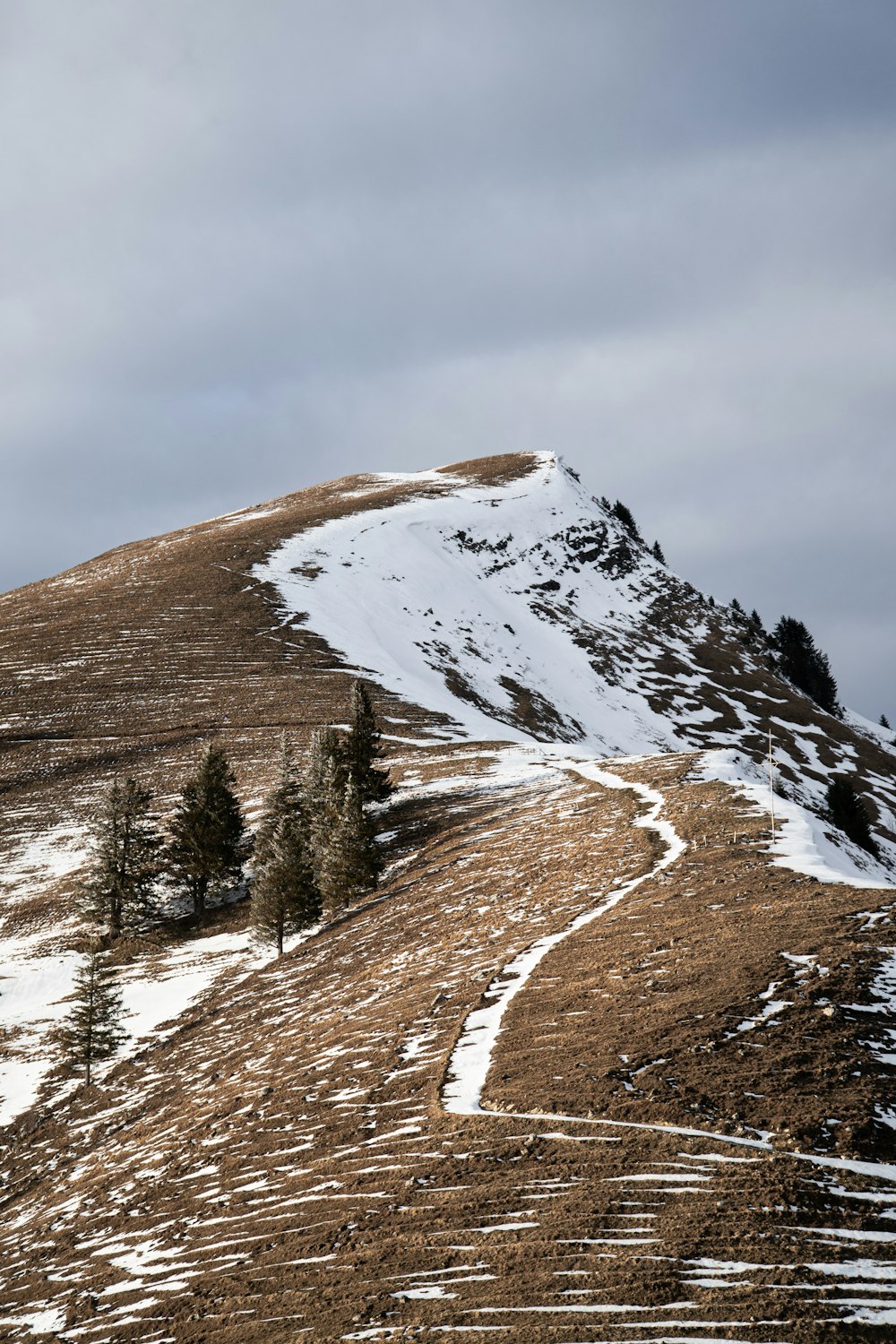 snow covered mountain during daytime