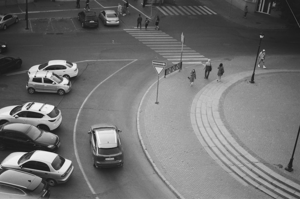 grayscale photo of cars on road