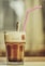 clear drinking glass with brown liquid