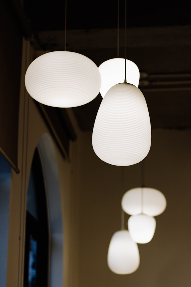 white pendant lamp turned on in room