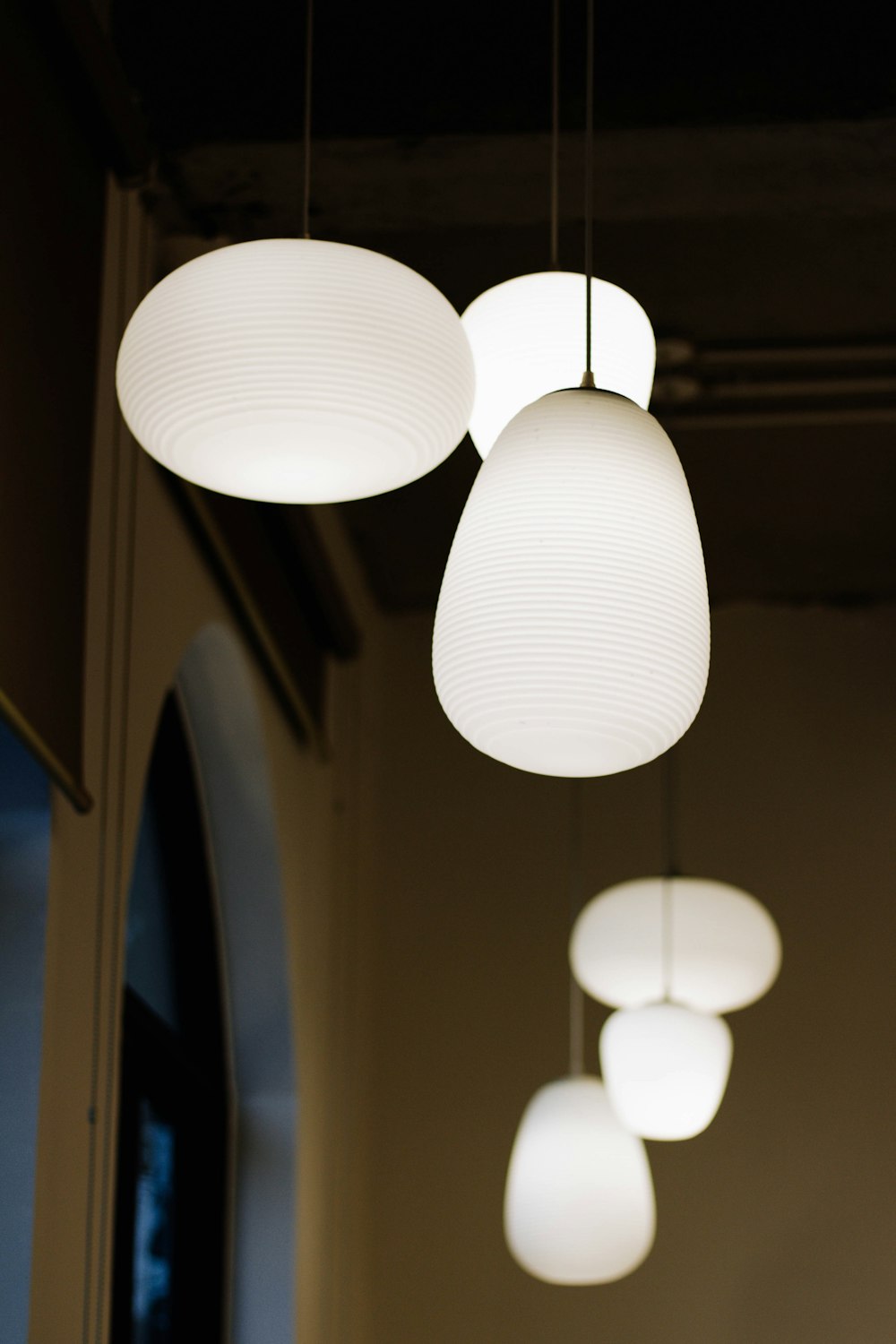 white pendant lamp turned on in room