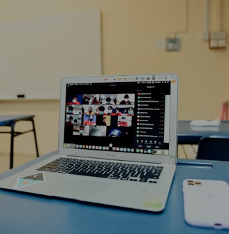 macbook pro on blue table