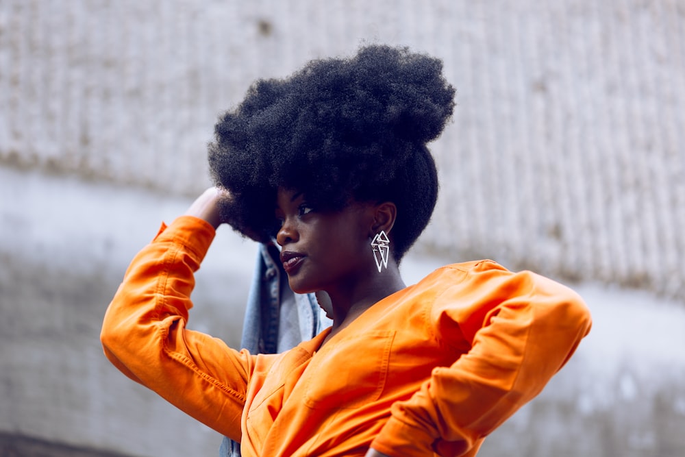 woman in orange long sleeve shirt