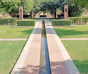 Newly installed French drainpipe system beside a landscaped garden.