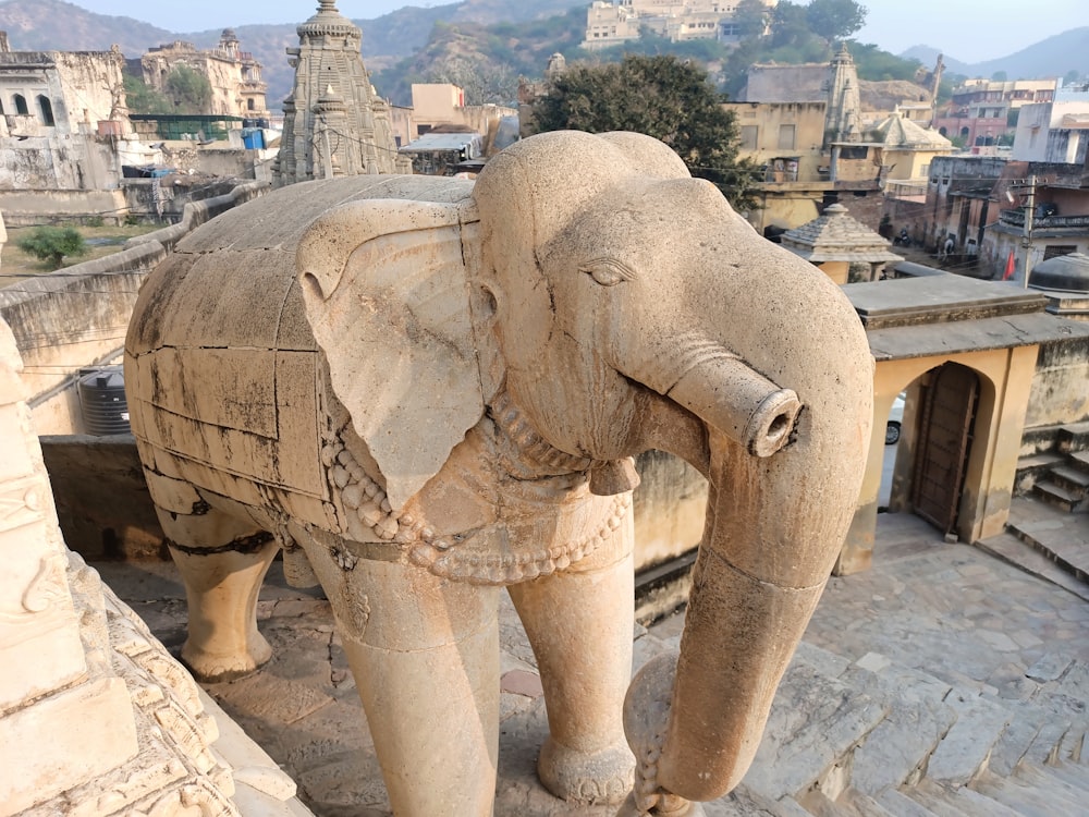 grey elephant statue on grey concrete floor during daytime