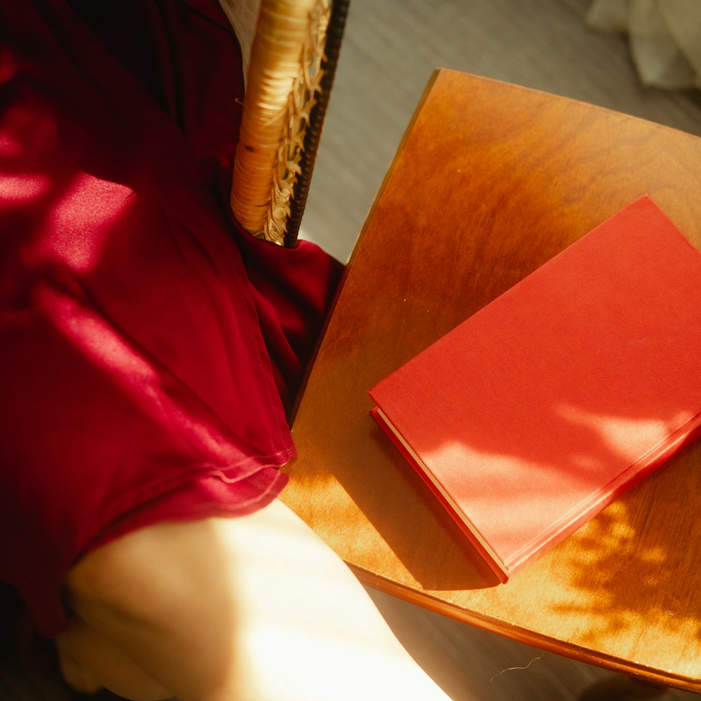 red textile on brown wooden table