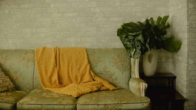 yellow towel on brown sofa