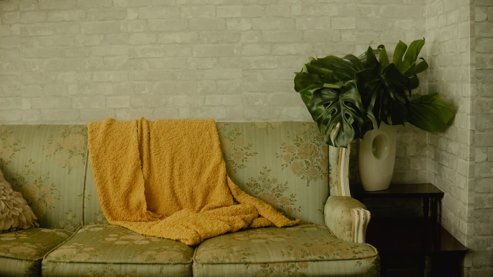 yellow towel on brown sofa