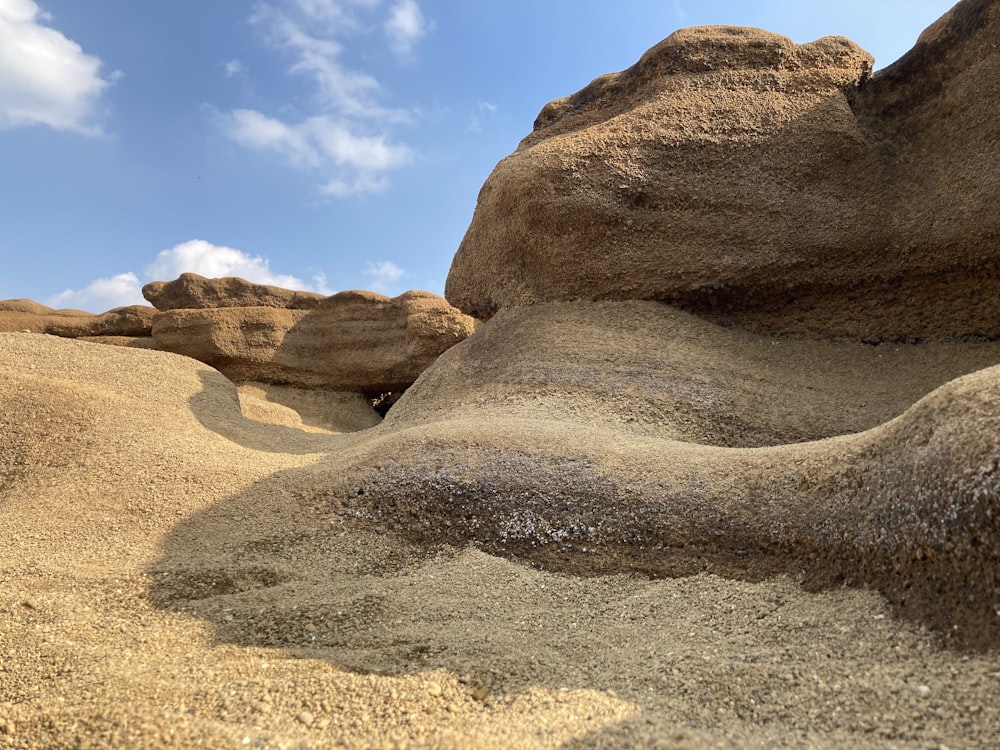 brown rock formation under blue sky during daytime