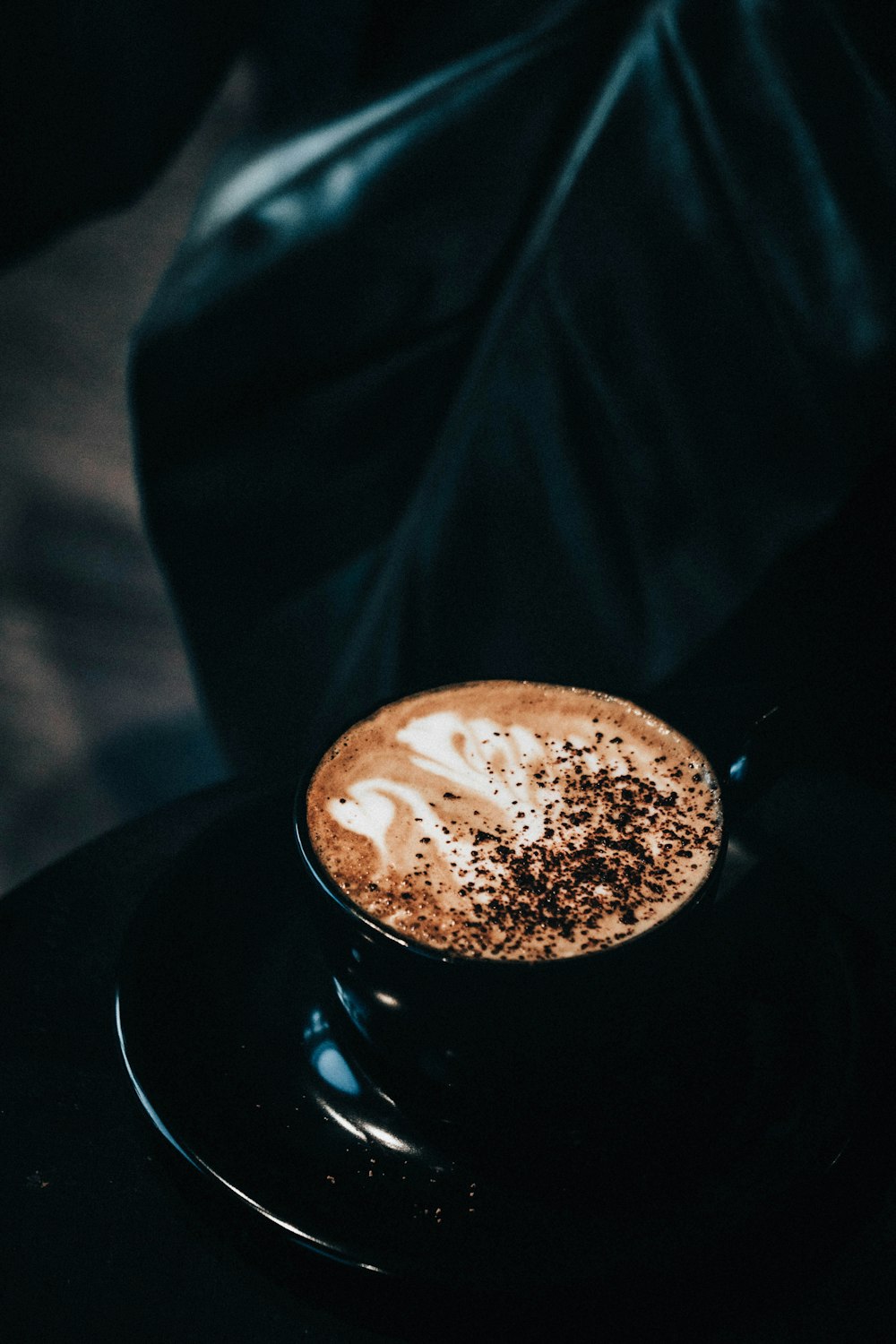 black ceramic mug with coffee