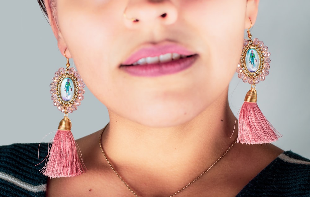 woman wearing silver necklace and earrings