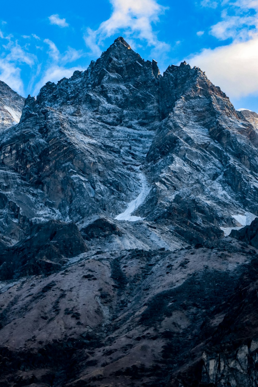 gray and white rocky mountain under blue sky during daytime