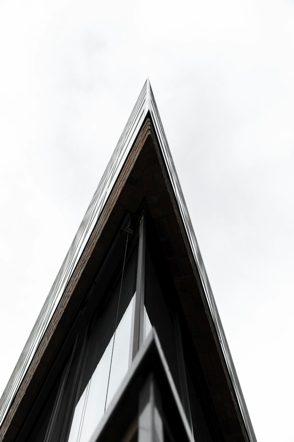 brown and black concrete building under white sky during daytime