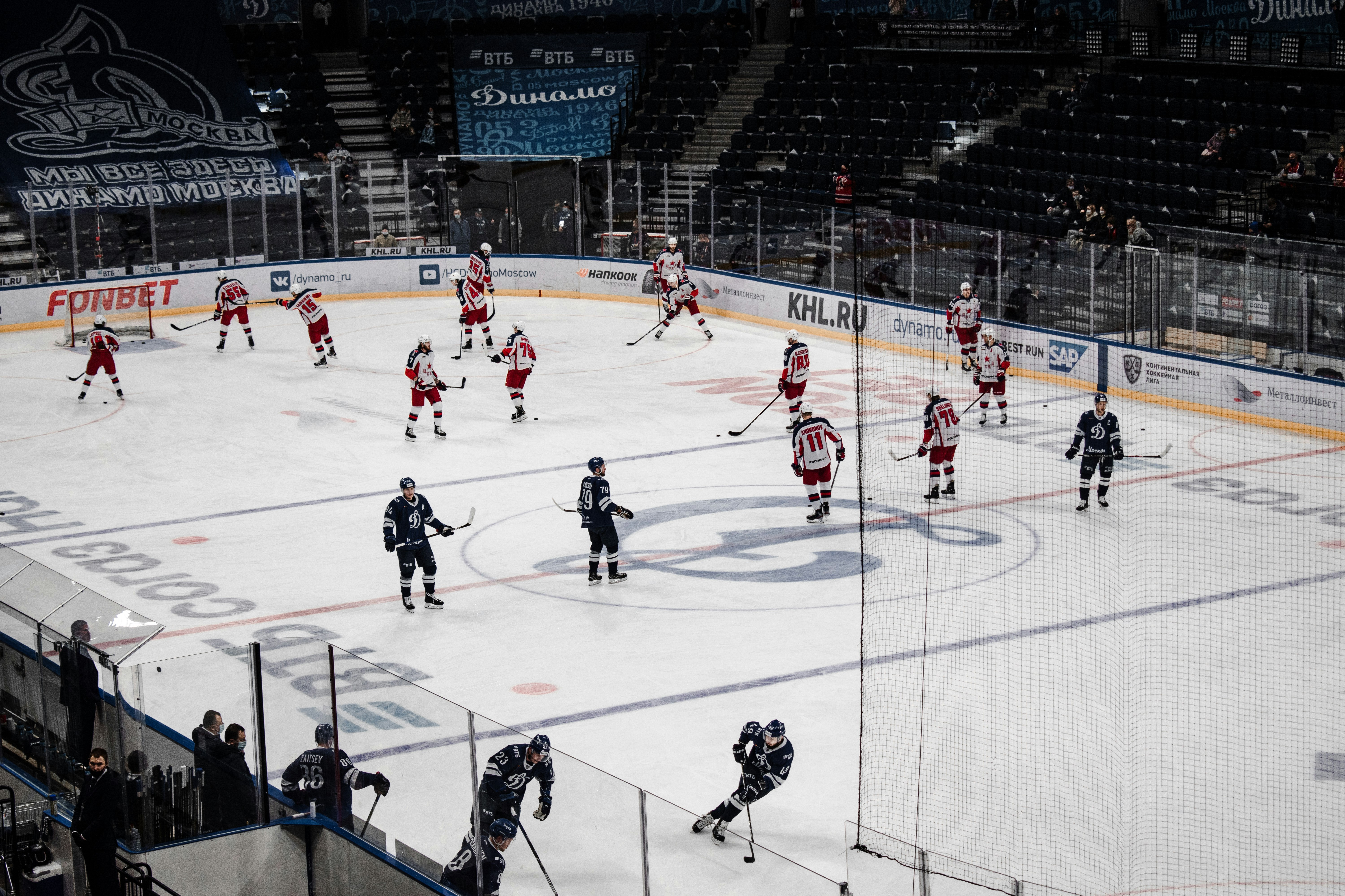 people playing ice hockey on ice stadium