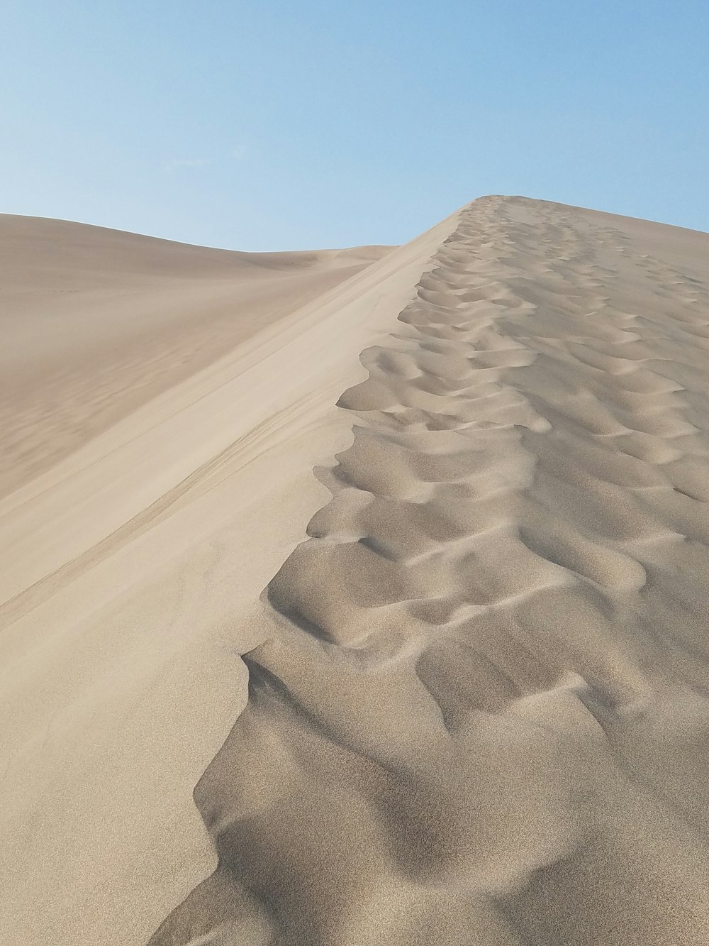 brown sand under blue sky during daytime