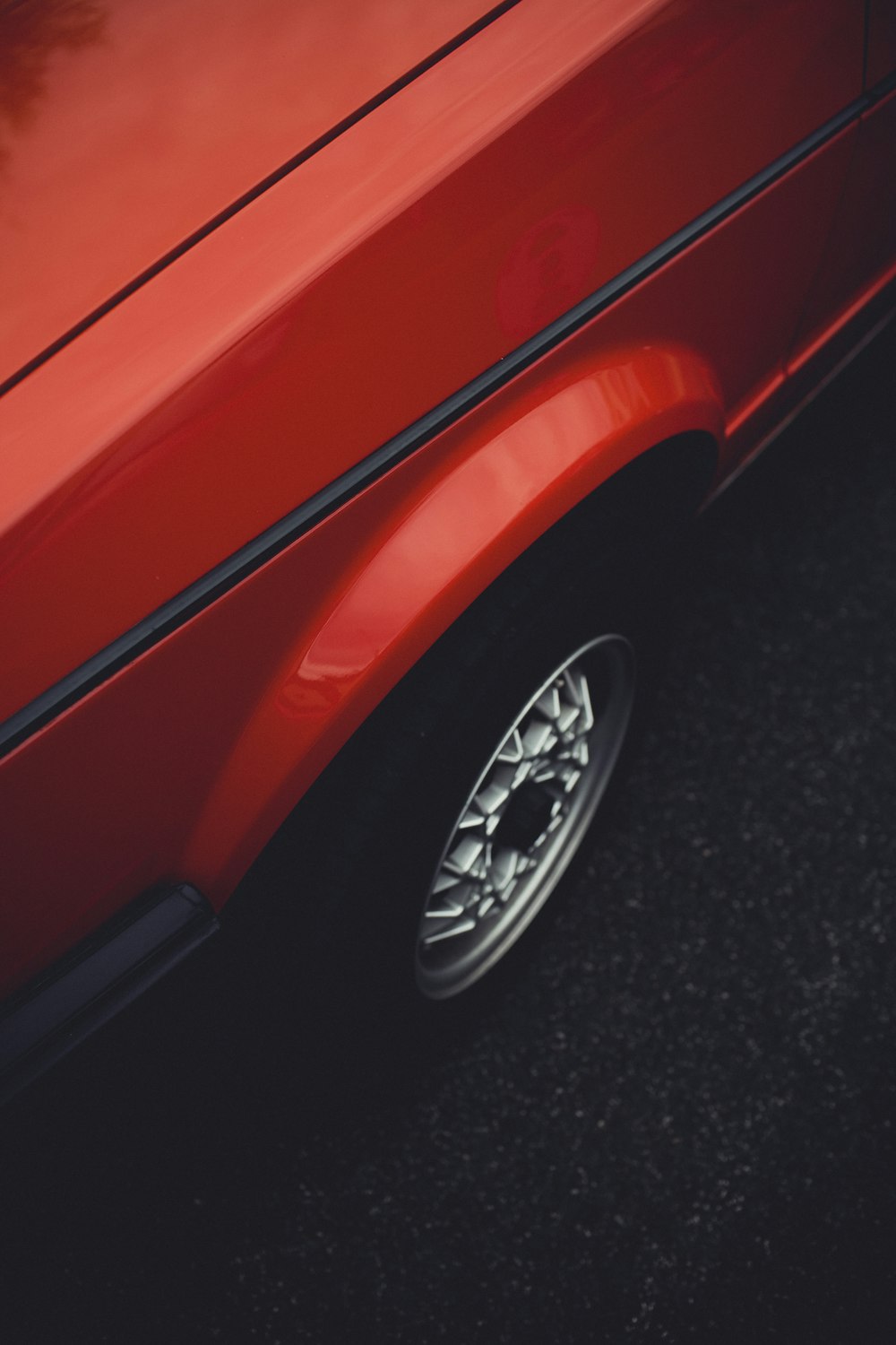 red car with chrome wheel