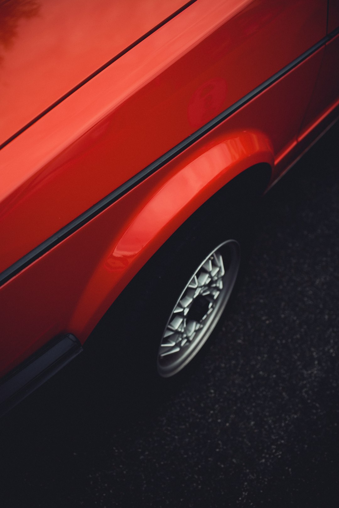 red car with chrome wheel