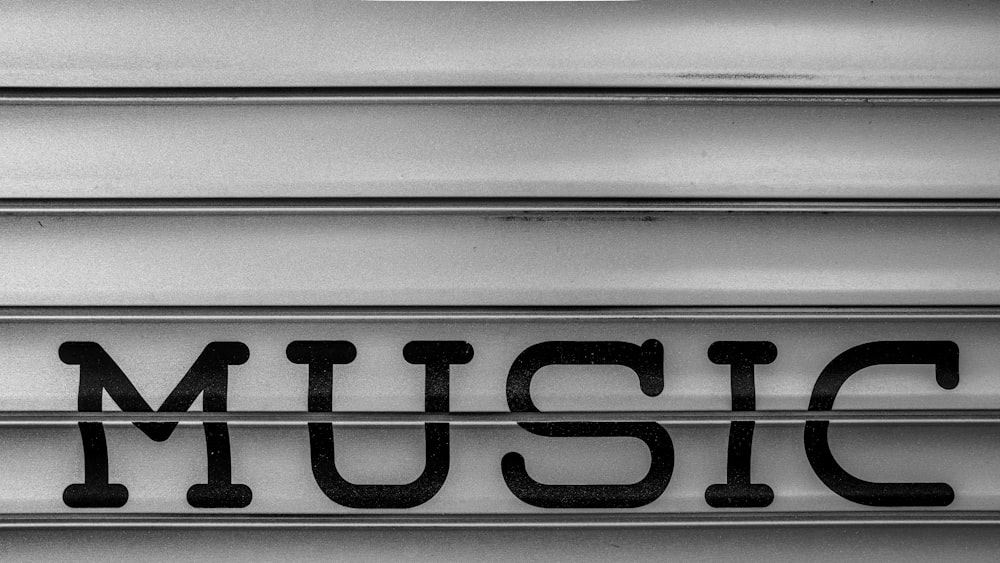 a close up of the word music written in black and white