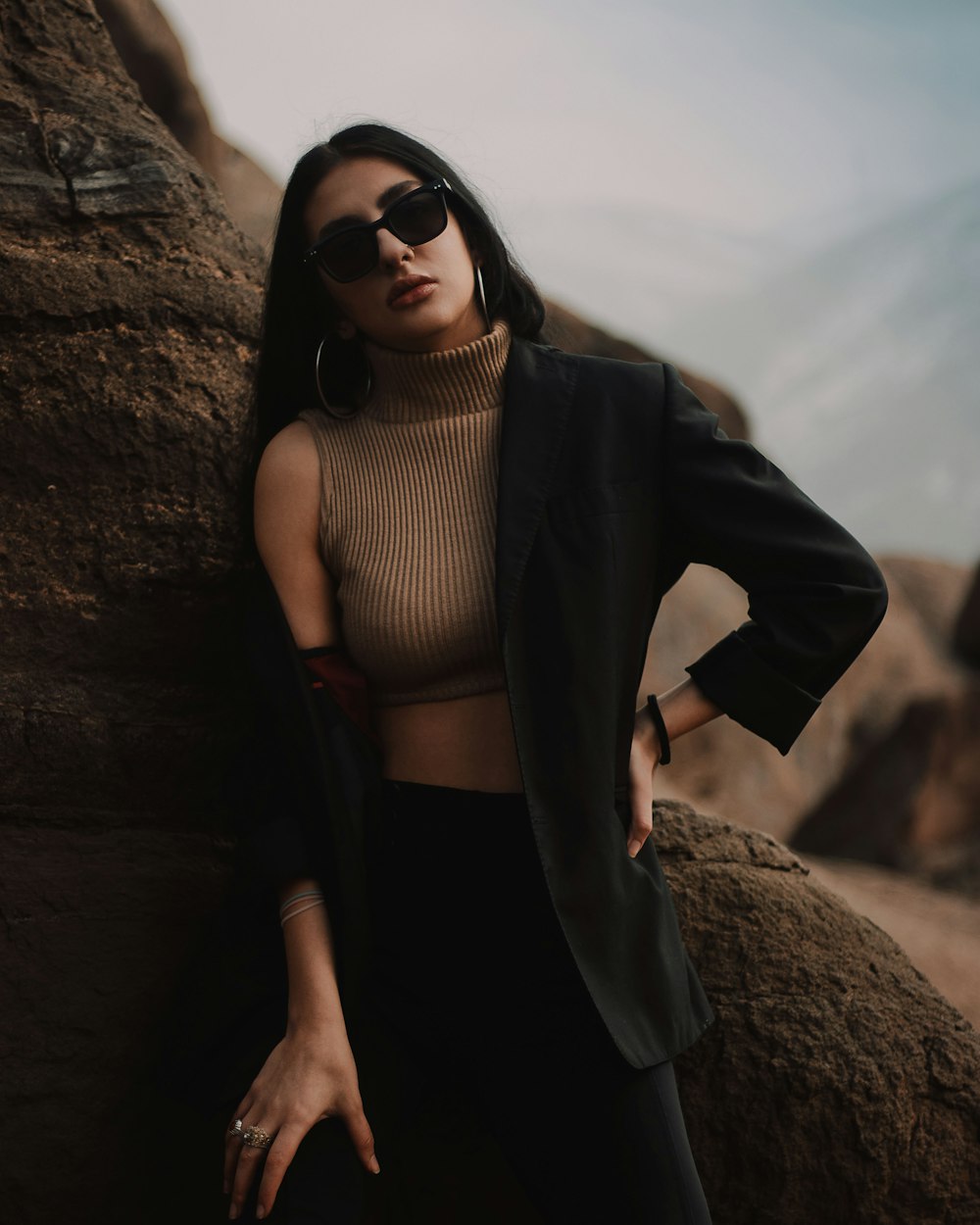 woman in black cardigan and white tank top