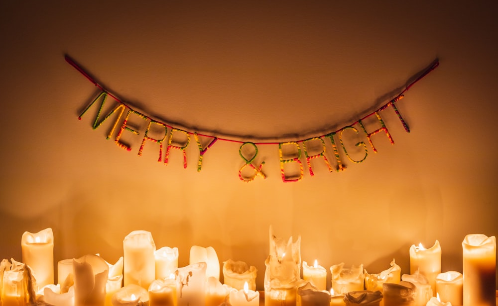 white candles on glass holder