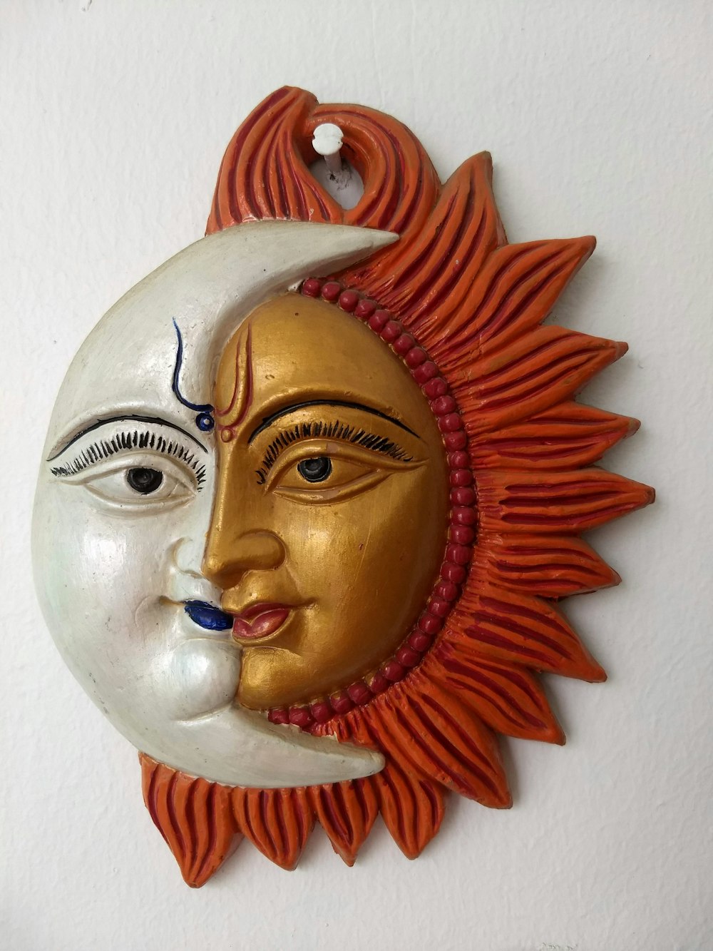 gold and red sun head bust