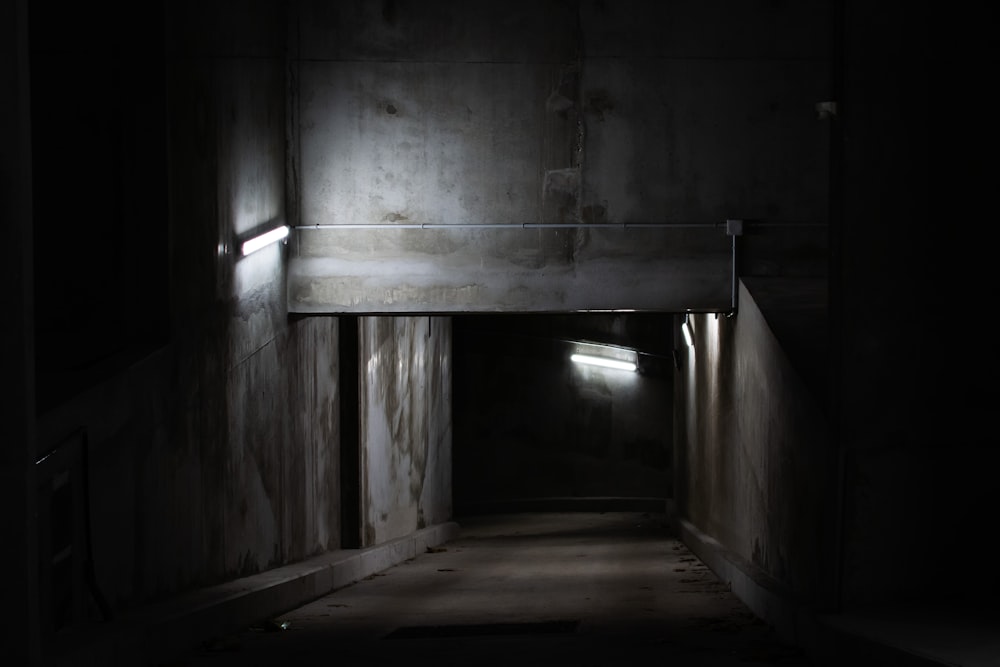 grayscale photo of a tunnel