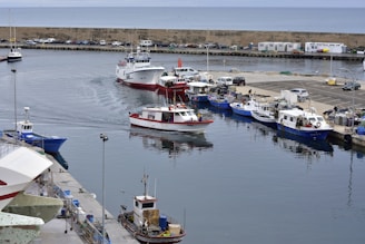 white and red boat on water during daytime