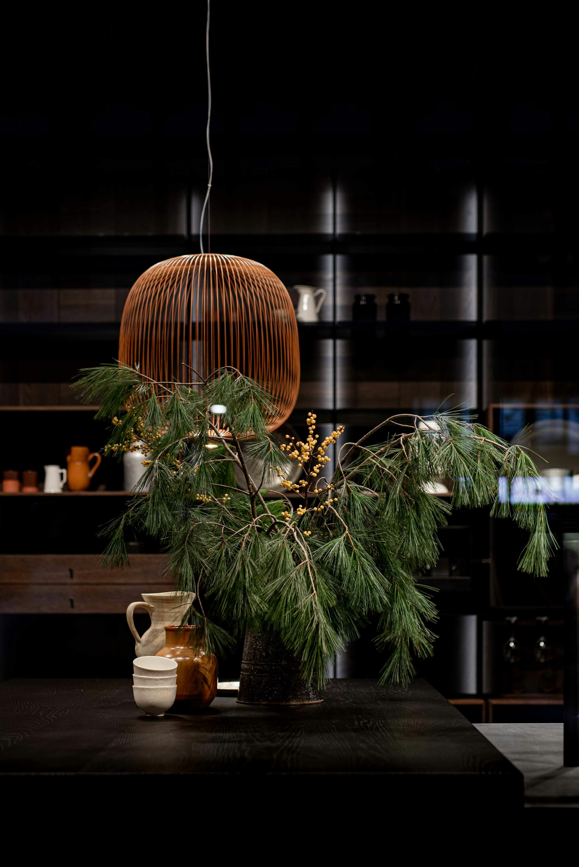 green pine tree with brown and white ceramic vase