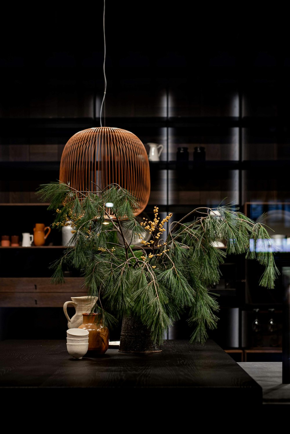 green pine tree with brown and white ceramic vase