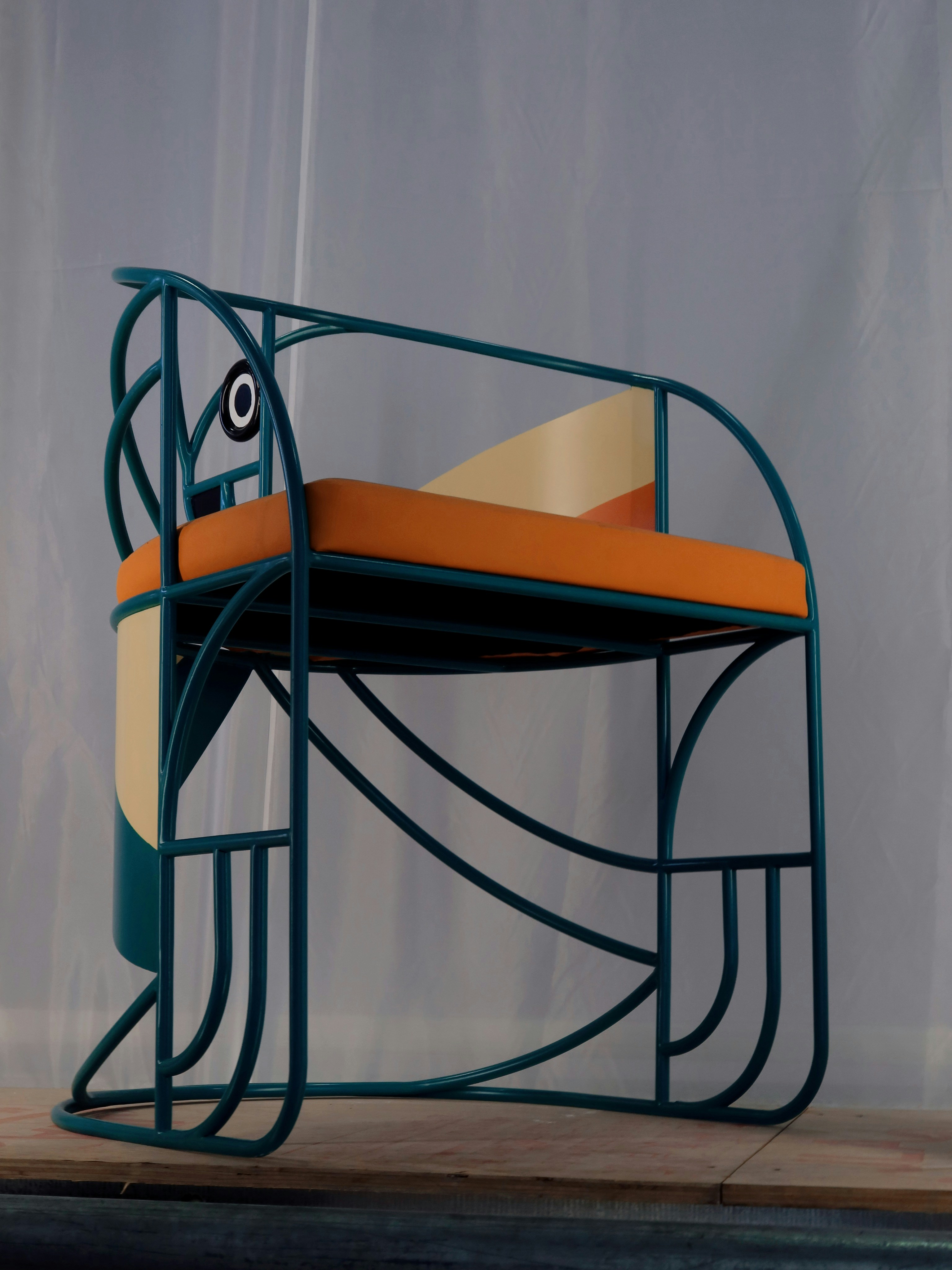 black metal framed yellow padded chair