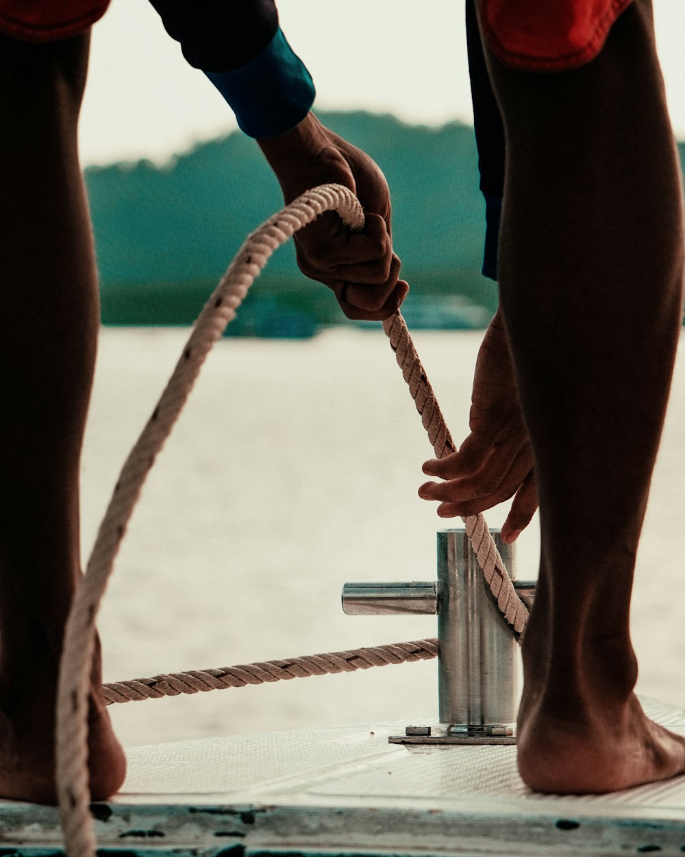 person holding brown rope during daytime