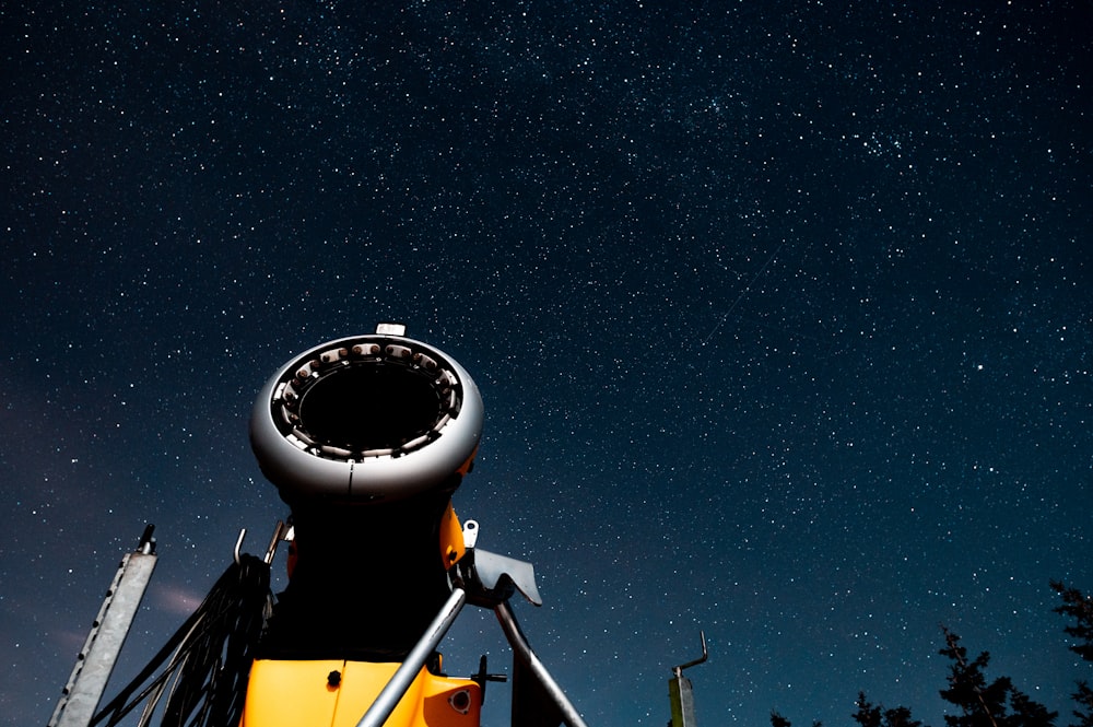 white and black satellite under starry night