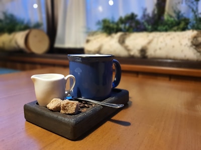 A cozy kitchen setting with mugs and coffee beans.