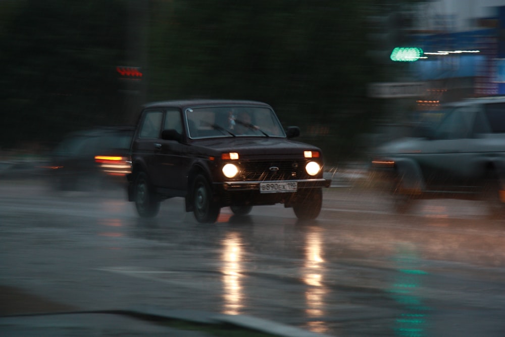 black suv on road during night time