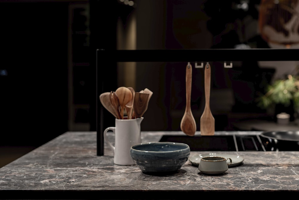 brown wooden spoon on blue ceramic bowl